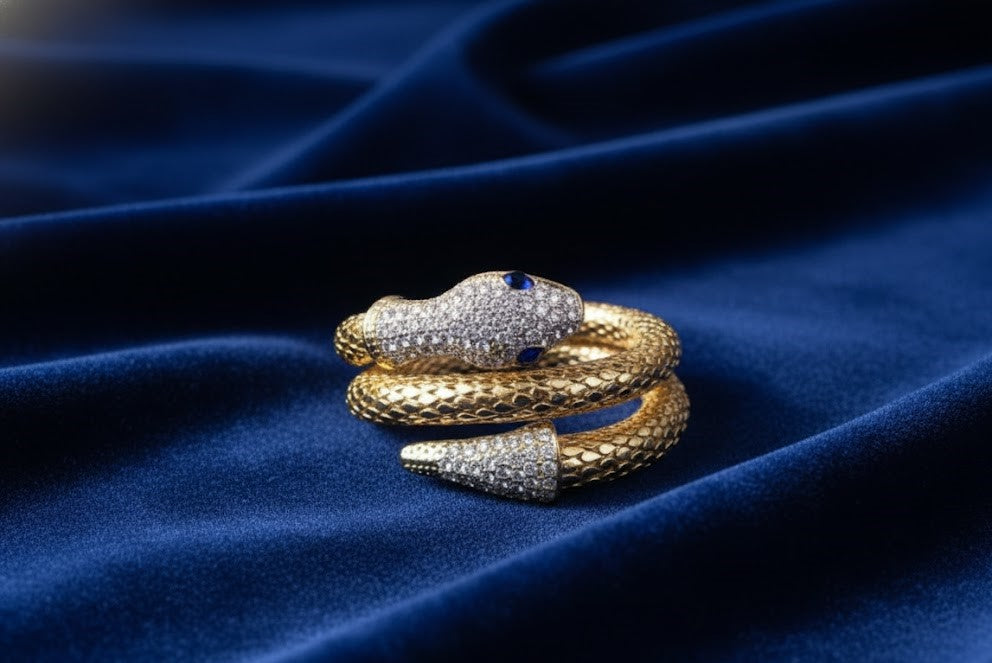 Yellow Gold Snake Wrap Bracelet with Diamond Pavé and Sapphire Eyes by Surogya