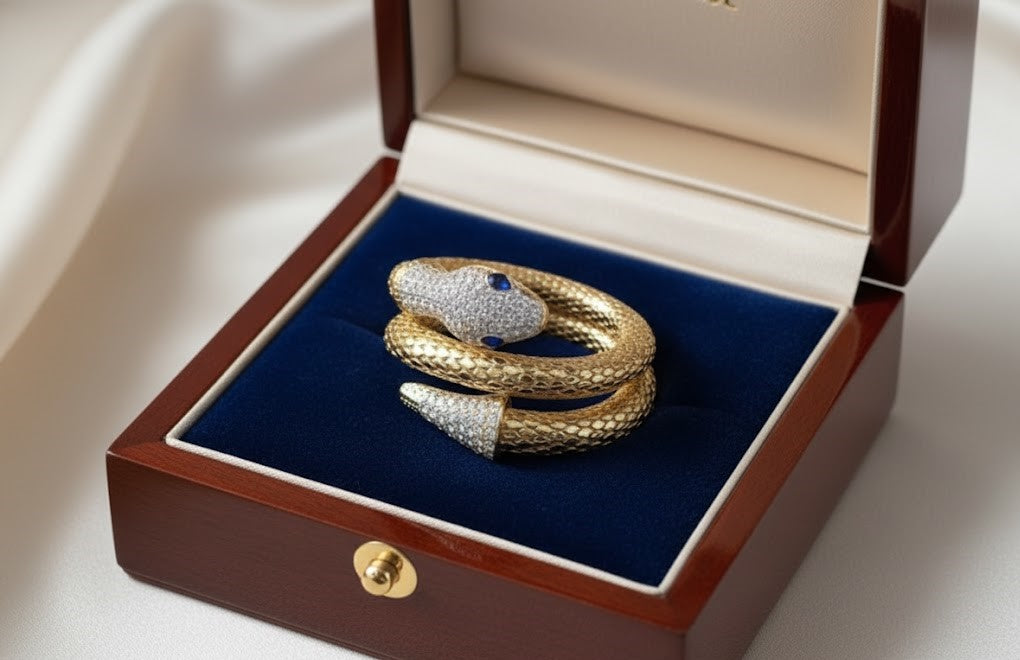 Yellow Gold Snake Wrap Bracelet with Diamond Pavé and Sapphire Eyes by Surogya