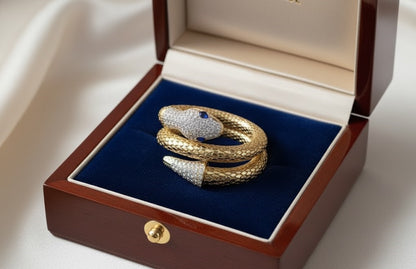 Yellow Gold Snake Wrap Bracelet with Diamond Pavé and Sapphire Eyes by Surogya