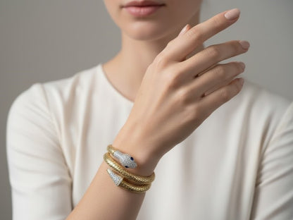 Yellow Gold Snake Wrap Bracelet with Diamond Pavé and Sapphire Eyes by Surogya