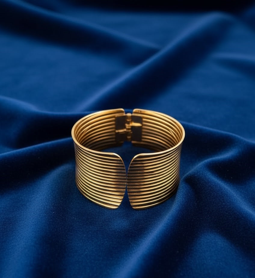 Surogya Bold Statement: Chunky Gold Ribbed Hinged Cuff Bracele