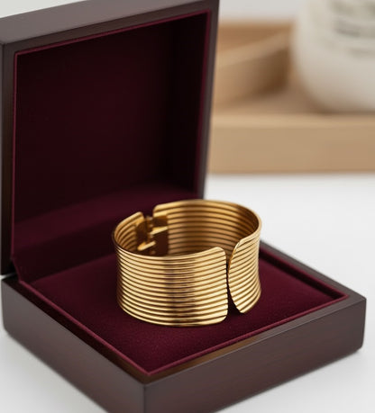 Surogya Bold Statement: Chunky Gold Ribbed Hinged Cuff Bracele
