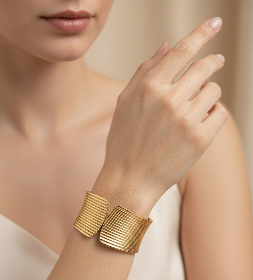 Surogya Bold Statement: Chunky Gold Ribbed Hinged Cuff Bracele