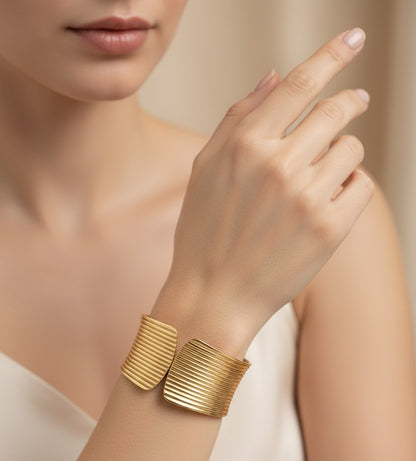 Surogya Bold Statement: Chunky Gold Ribbed Hinged Cuff Bracele