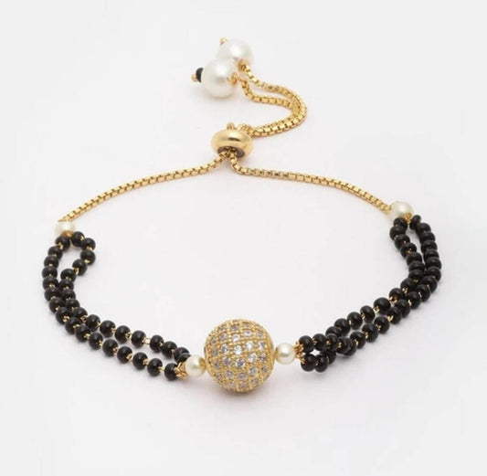 Surogya Adjustable Black Beads Mangalsutra Bracelet with Golden Stone Ball